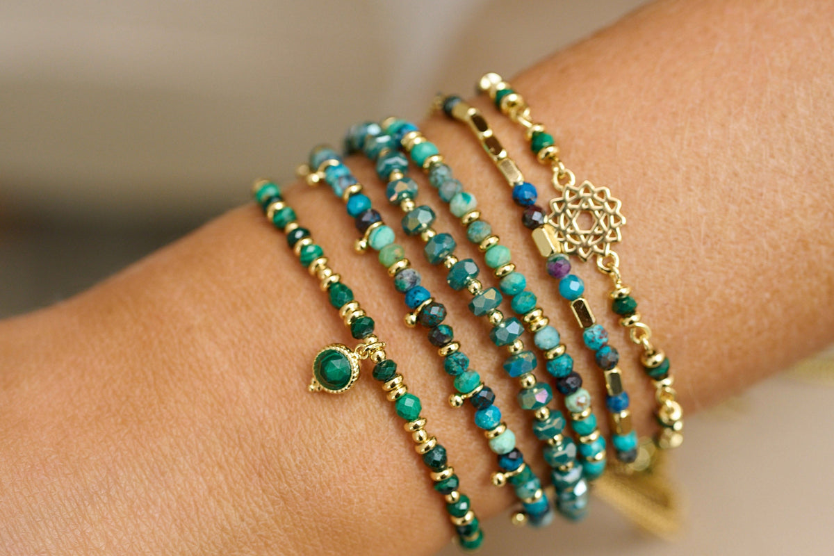 Prunus Green & Gold Bracelet lifestyle shot with multiple green gemstone bracelets