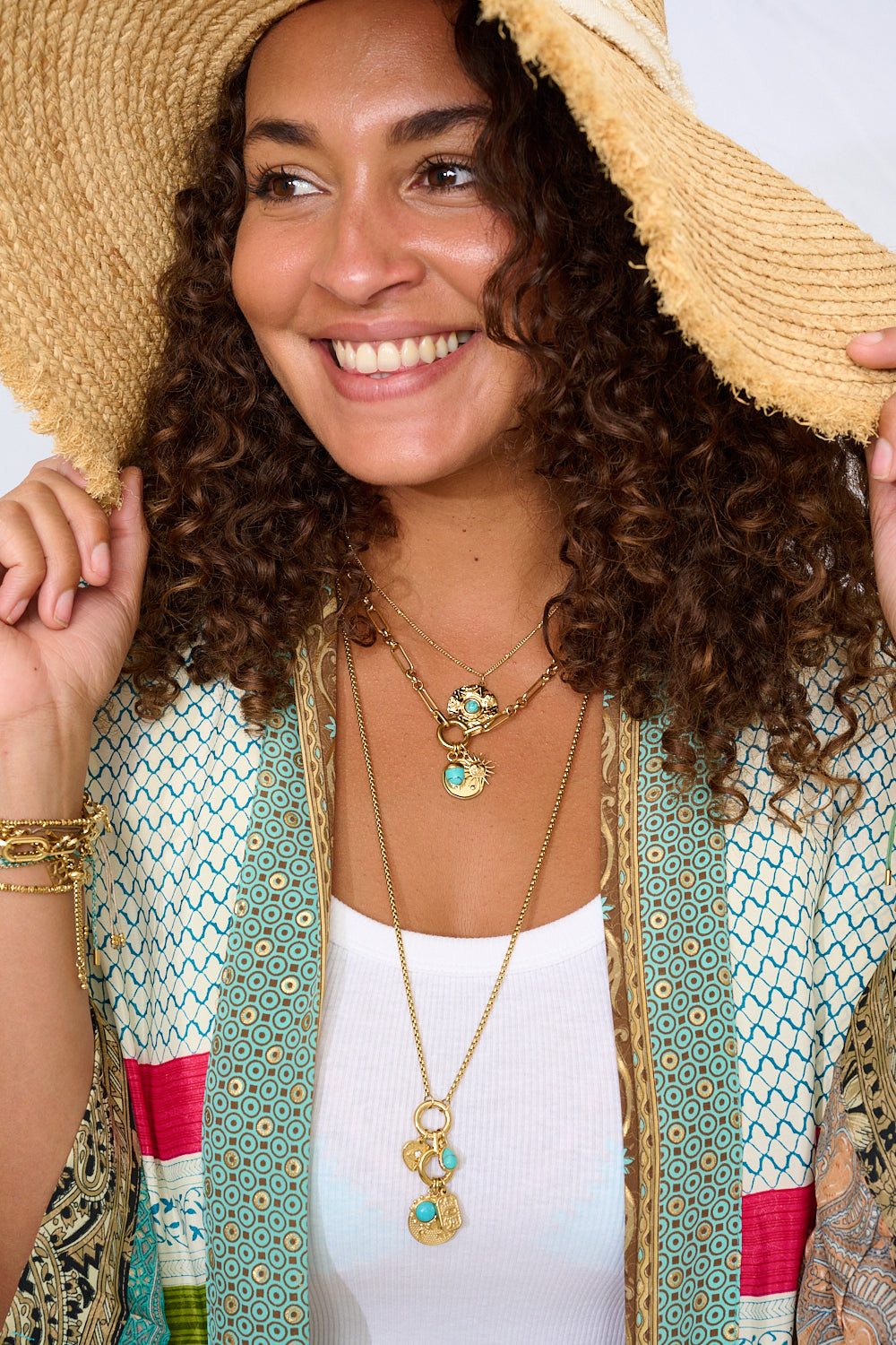 Layer your necklaces with summer style with the Hemani, Luma and Nerissa in Turquoise Howlite with gleaming gold.