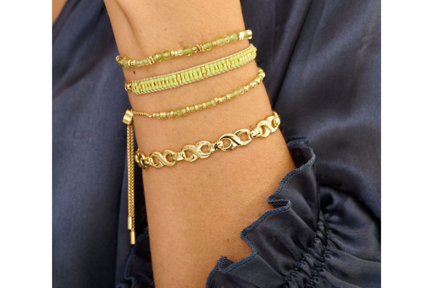 Beautiful Boho Betty Stack of bracelets including the Mystical, Aslan, Infinite Gold Chain and Bliss to brighten any autumn outfit!