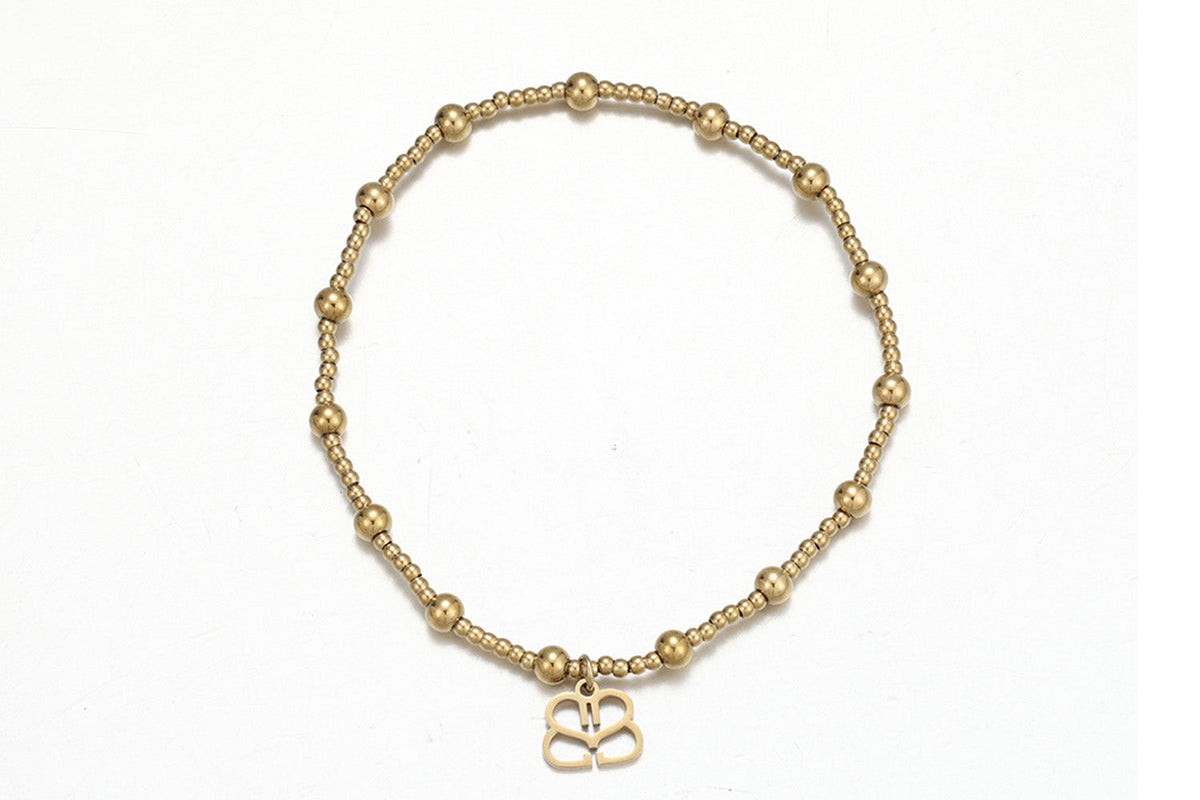 Rosa waterproof gold bead stretch bracelet by Boho Betty – fine and larger gold beads with logo charm, 18cm stretch fit, stackable and waterproof