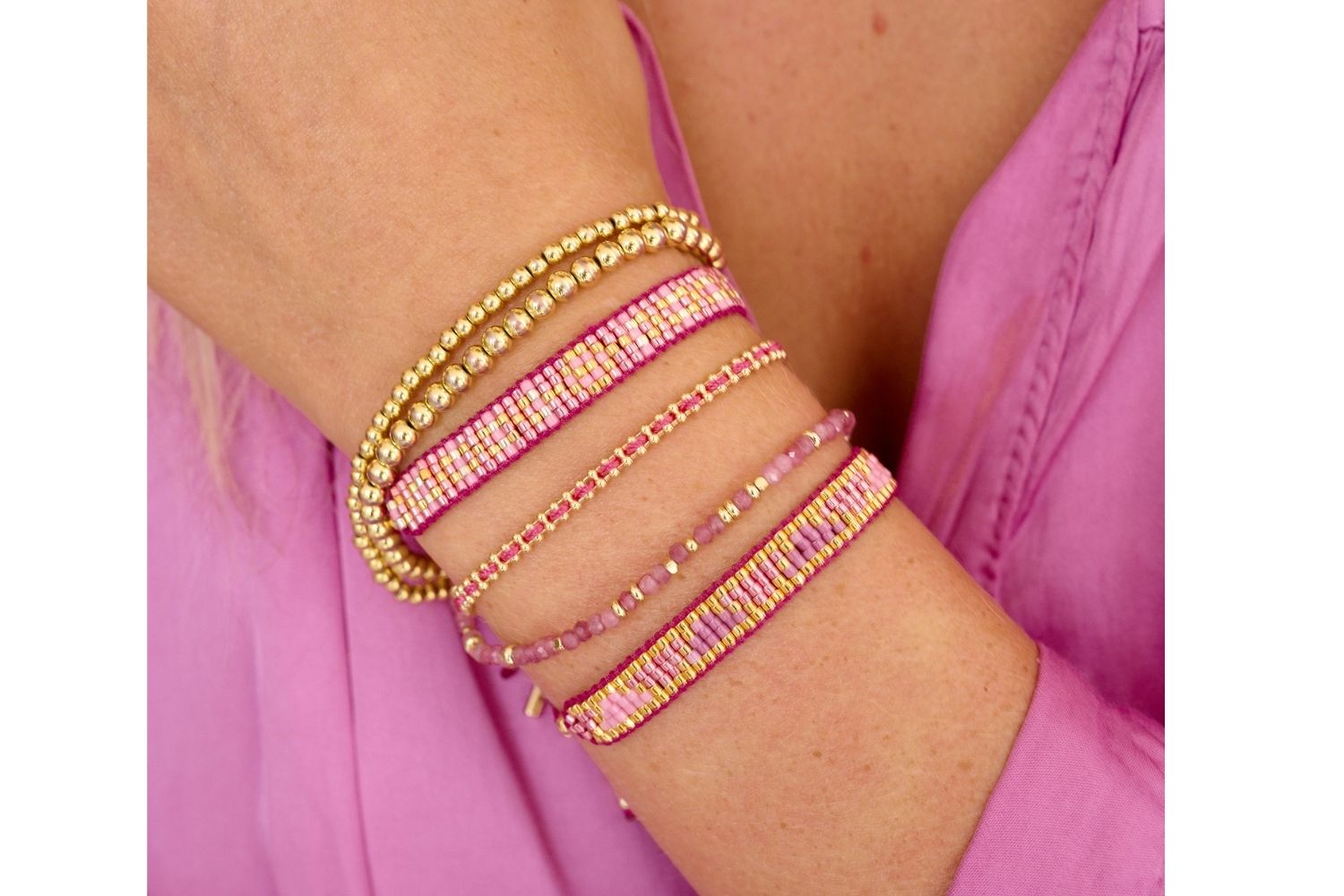 Gold and Pink Bracelets pack a punch with this lifestyle stack including the Sable Minor Gold Bracelet Set, Venus point, braid in Pink!