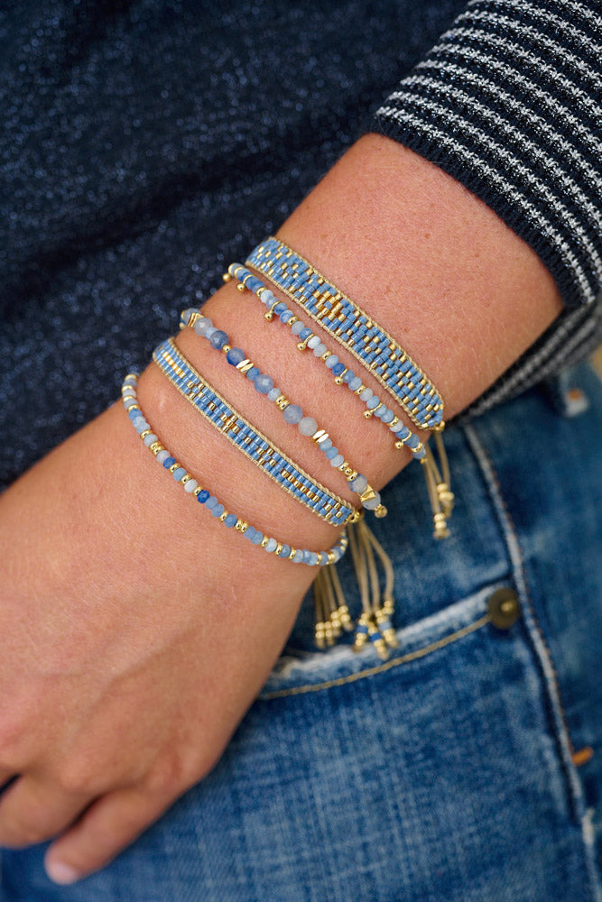 Abaco Blue Aventurine Gold Bracelet Stack styled on the wrist, showcasing serene blue gemstones, Miyuki beads, and shimmering gold accents for a boho-chic, grounded look.