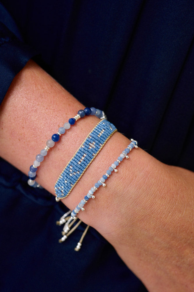 Amilla Blue Aventurine Silver Bracelet Stack styled on the wrist, showcasing cool blue gemstones, silver Miyuki beads, and shimmering silver accents for a chic boho look.