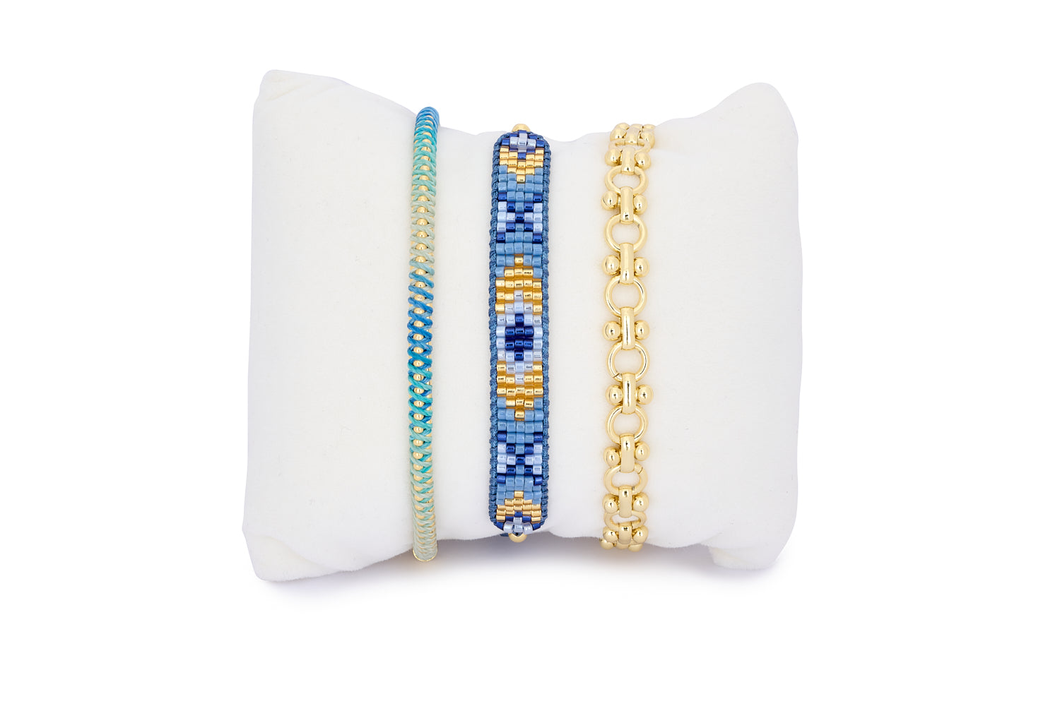 Bora Bora Blue & Gold Bracelet Stack featuring three boho-chic bracelets—hand-braided cord, Miyuki beading, and bold gold chain links in ocean-inspired tones.