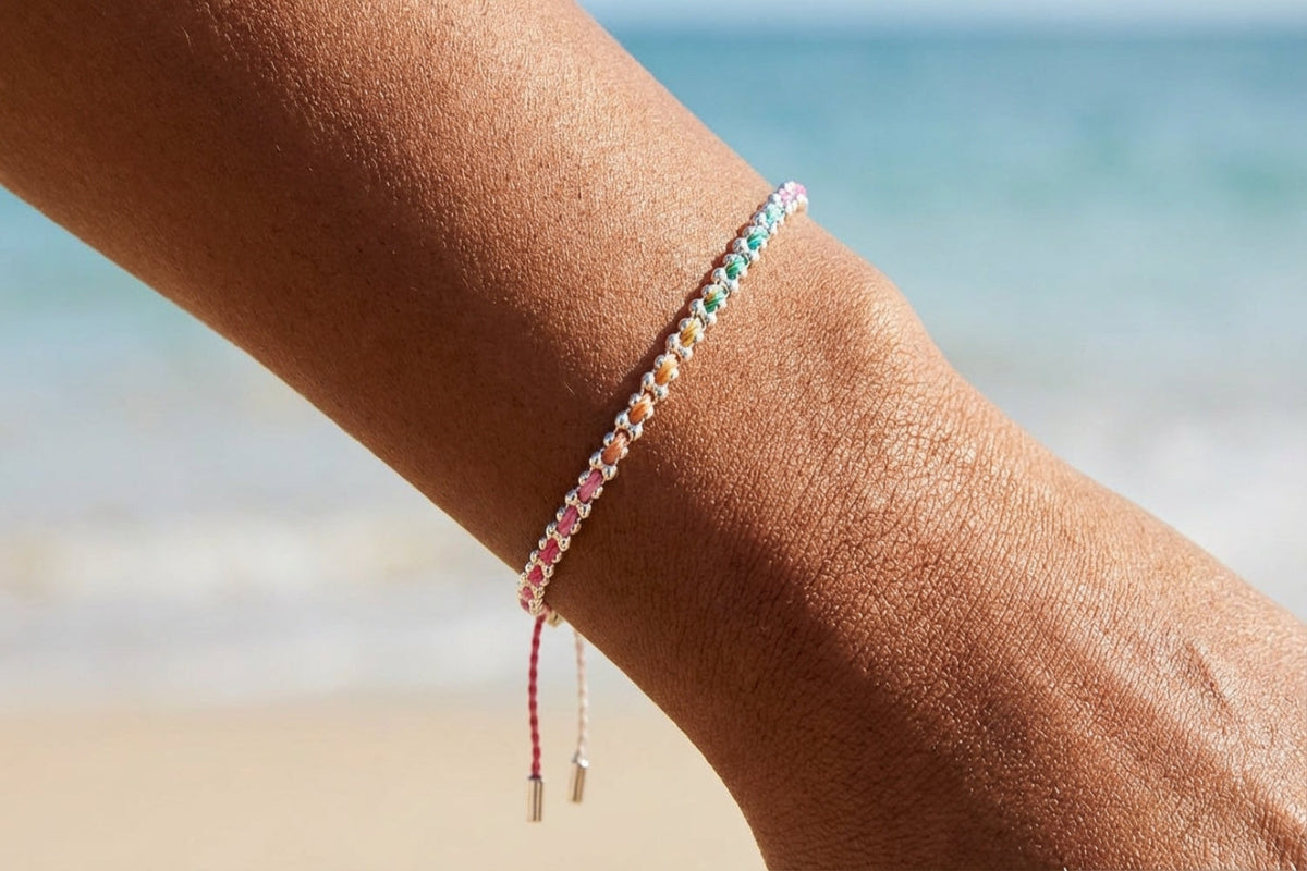Braid Candy Silver Woven Bracelet on marble surface
