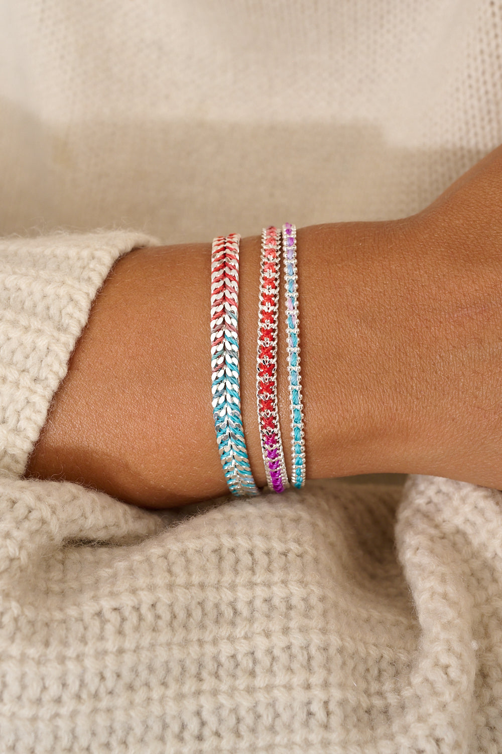 Braid Moroccan Spice Silver Woven Bracelet featured on stacked wrist with other Boho Betty bracelets