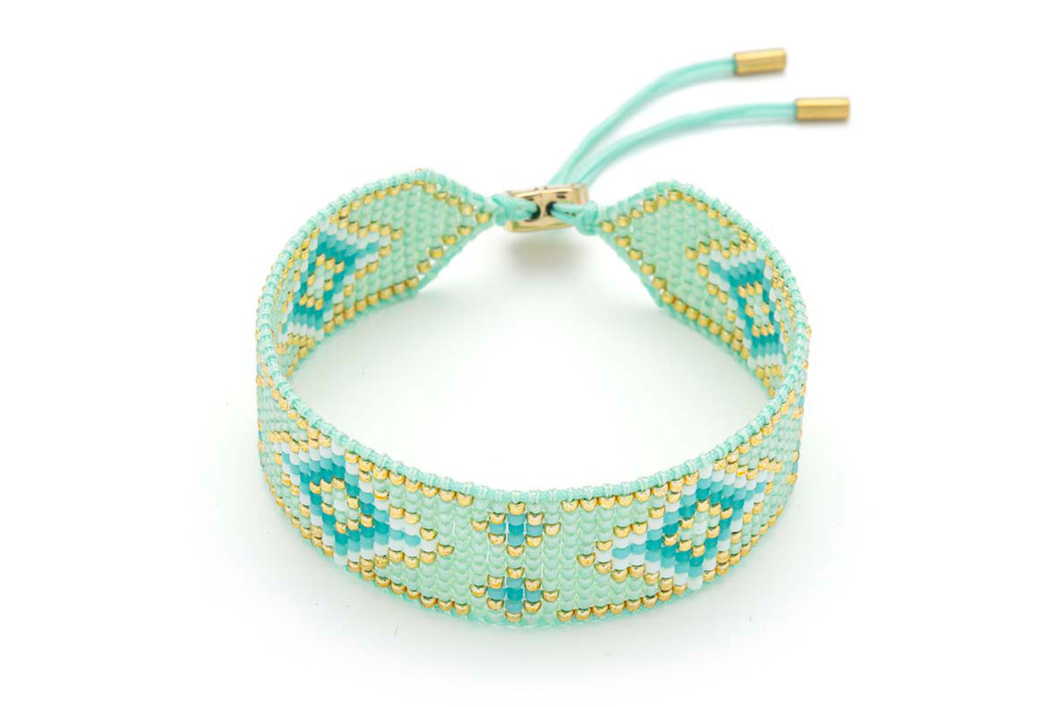 Carys Aqua Gold Friendship Bracelet featuring a mix of handwoven aqua, teal, and gold Miyuki beads with a 12k gold-plated adjustable slider fastening.