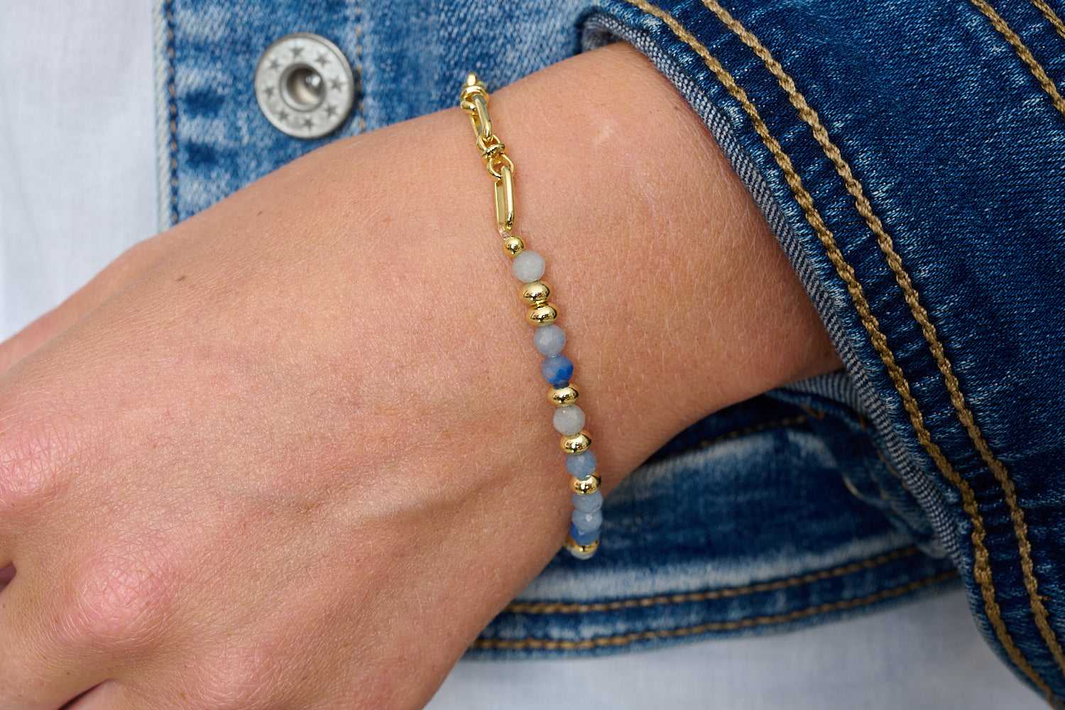 Dahlia Blue Aventurine & Gold Beaded Bracelet featured on wrist with Boho Betty stacking bracelets in gold and blue gemstone tones.