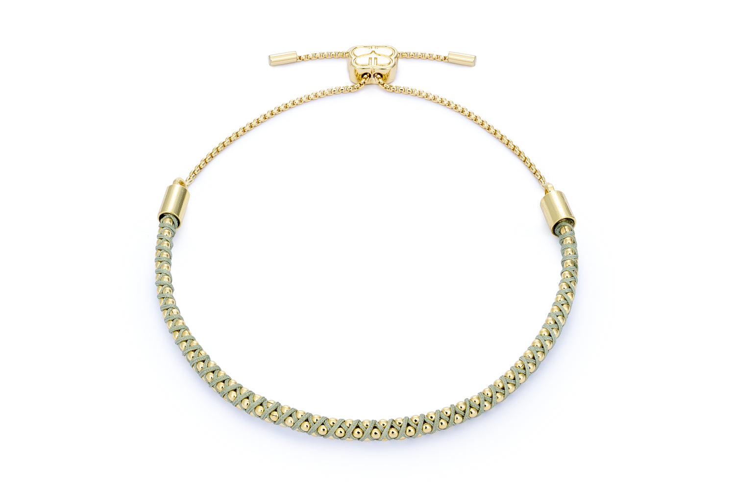 Emelia Gold & Pale Green Woven Bracelet with sage-green threading and 12k gold-plated accents, featuring an adjustable slider fastening.