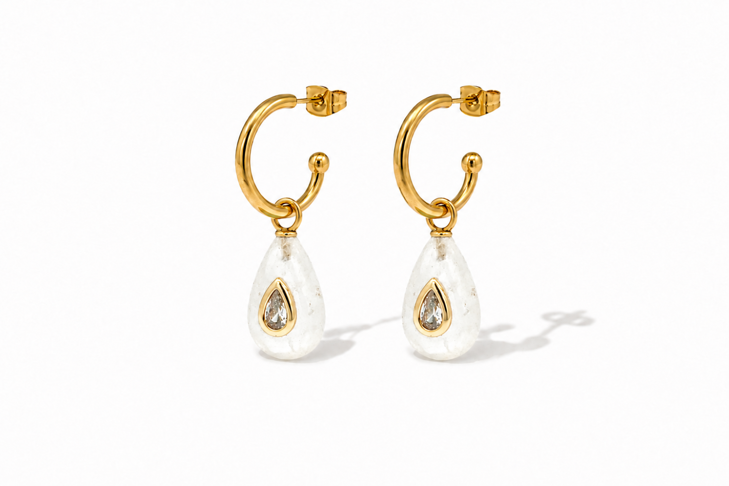 Hana Clear Quartz Gold Hoop Earrings featuring natural clear quartz gemstone drops with sparkling crystal details on waterproof 14k gold PVD hoops.