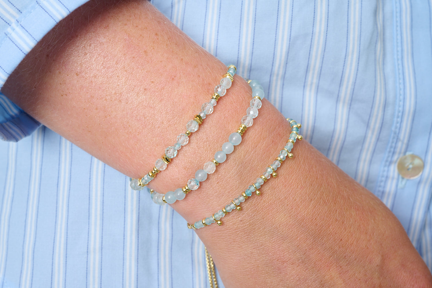 Harmony November birthstone bracelet with blue topaz beads featured on wrist with Boho Betty stacking bracelets