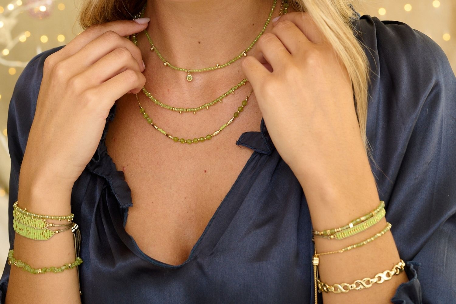 Jasmine Gold & Peridot Beaded Pendant Necklace styled on the neck, showcasing the vibrant green peridot beads and golden accents, ideal for August-born beauties.