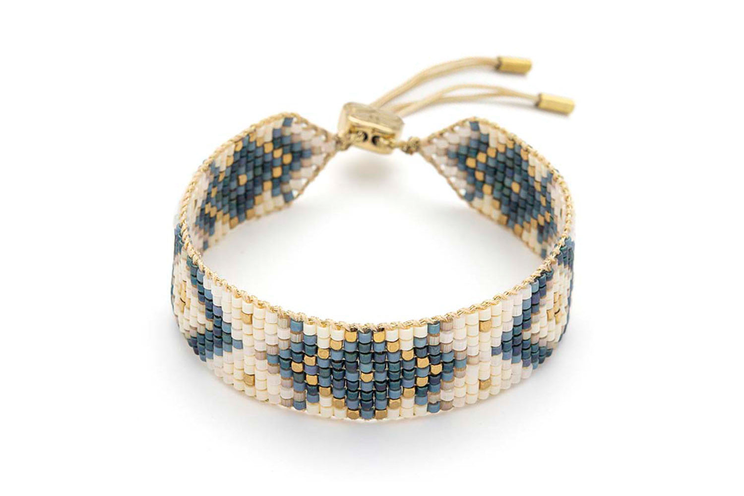 Junie Navy Gold Friendship Bracelet featuring navy, ivory, and gold Miyuki beads, with 12k gold-plated brass details and an adjustable slider fastening.