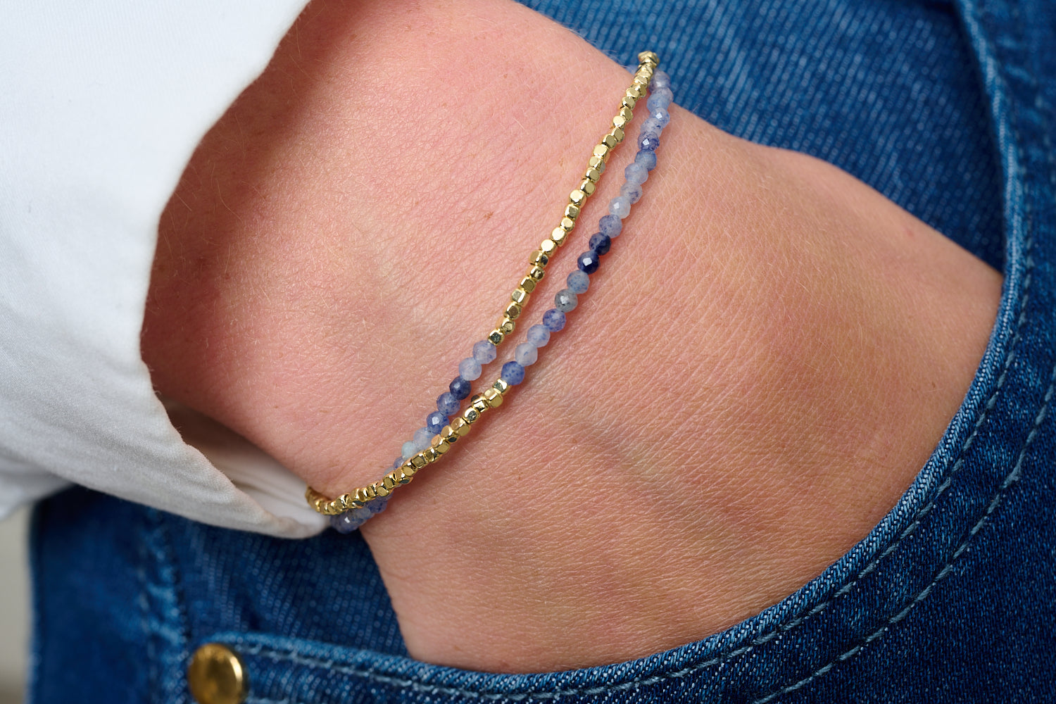 Juniper Blue Aventurine & Gold Multi-Strand Bracelet featured on wrist with Boho Betty stacking bracelets in gold and blue gemstone tones.