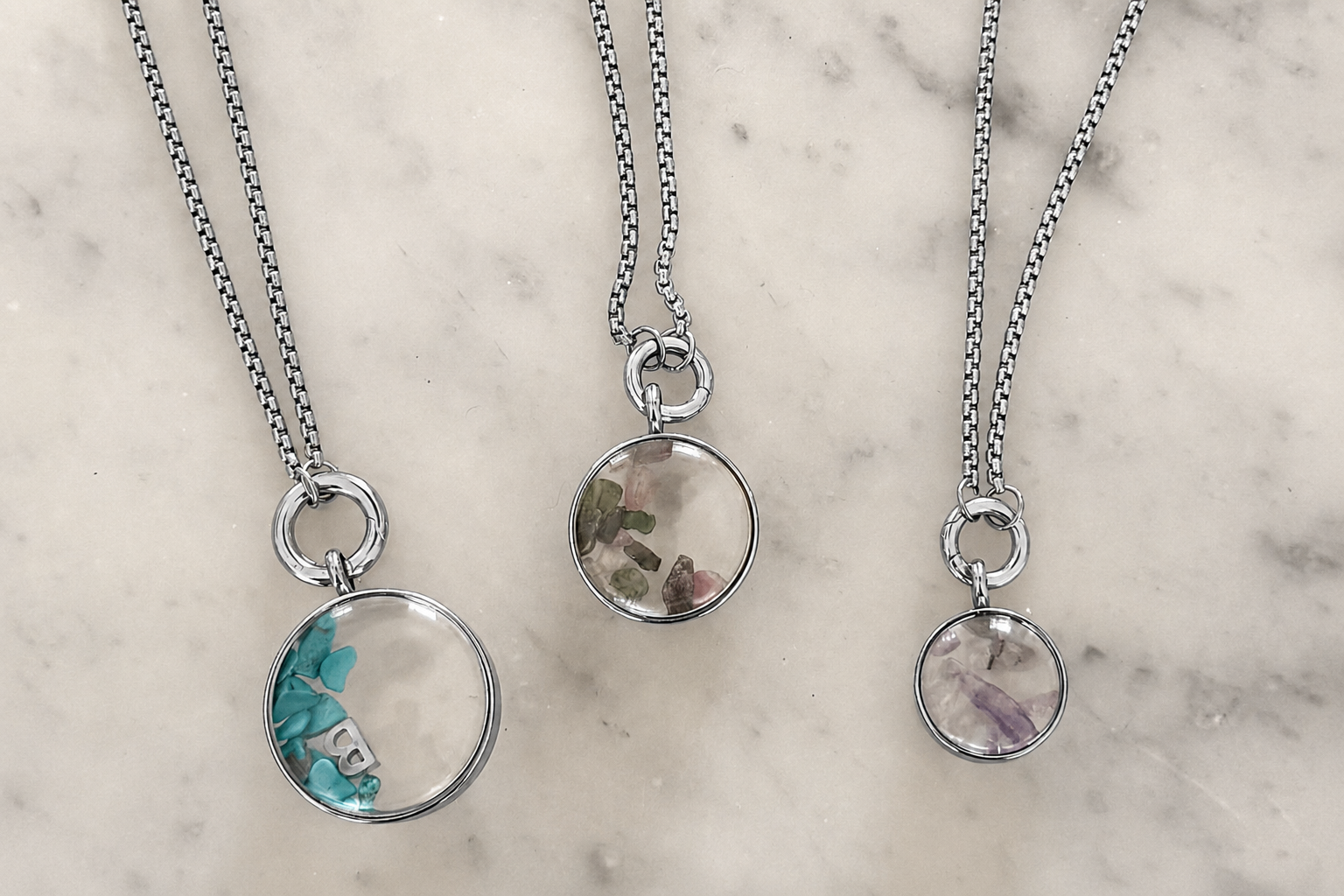 Leilani midi silver locket necklace styled on the neckline, a personalised charm locket perfect for layering and everyday wear.