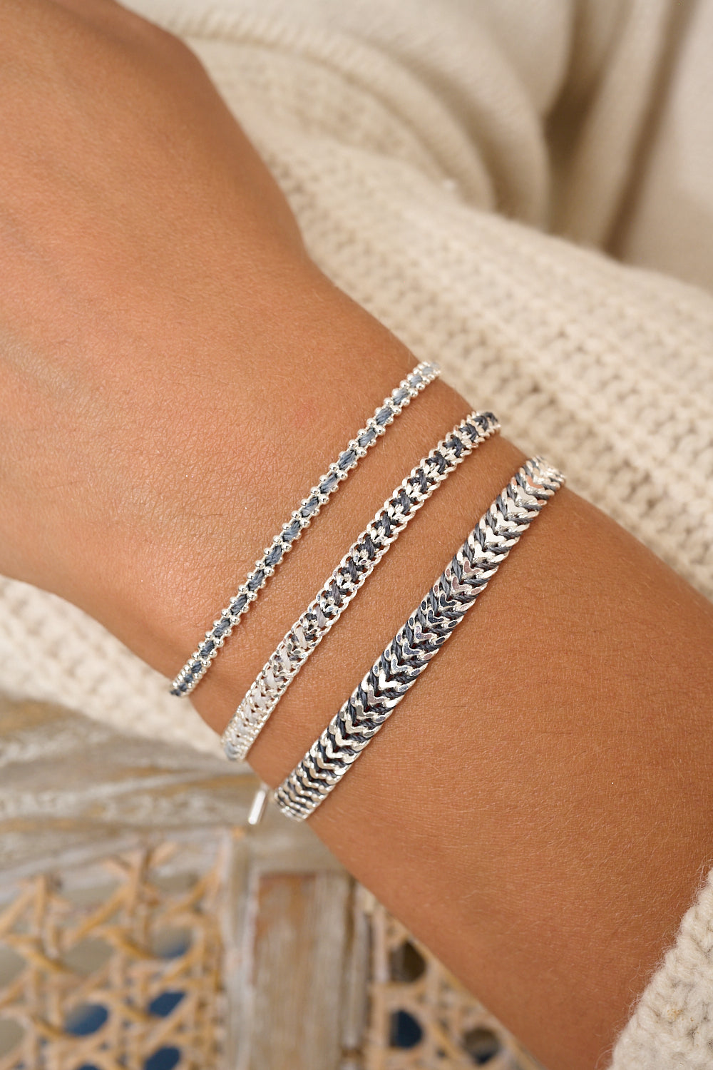 Lilia charcoal and silver bracelet featured on wrist with Boho Betty stacking bracelets