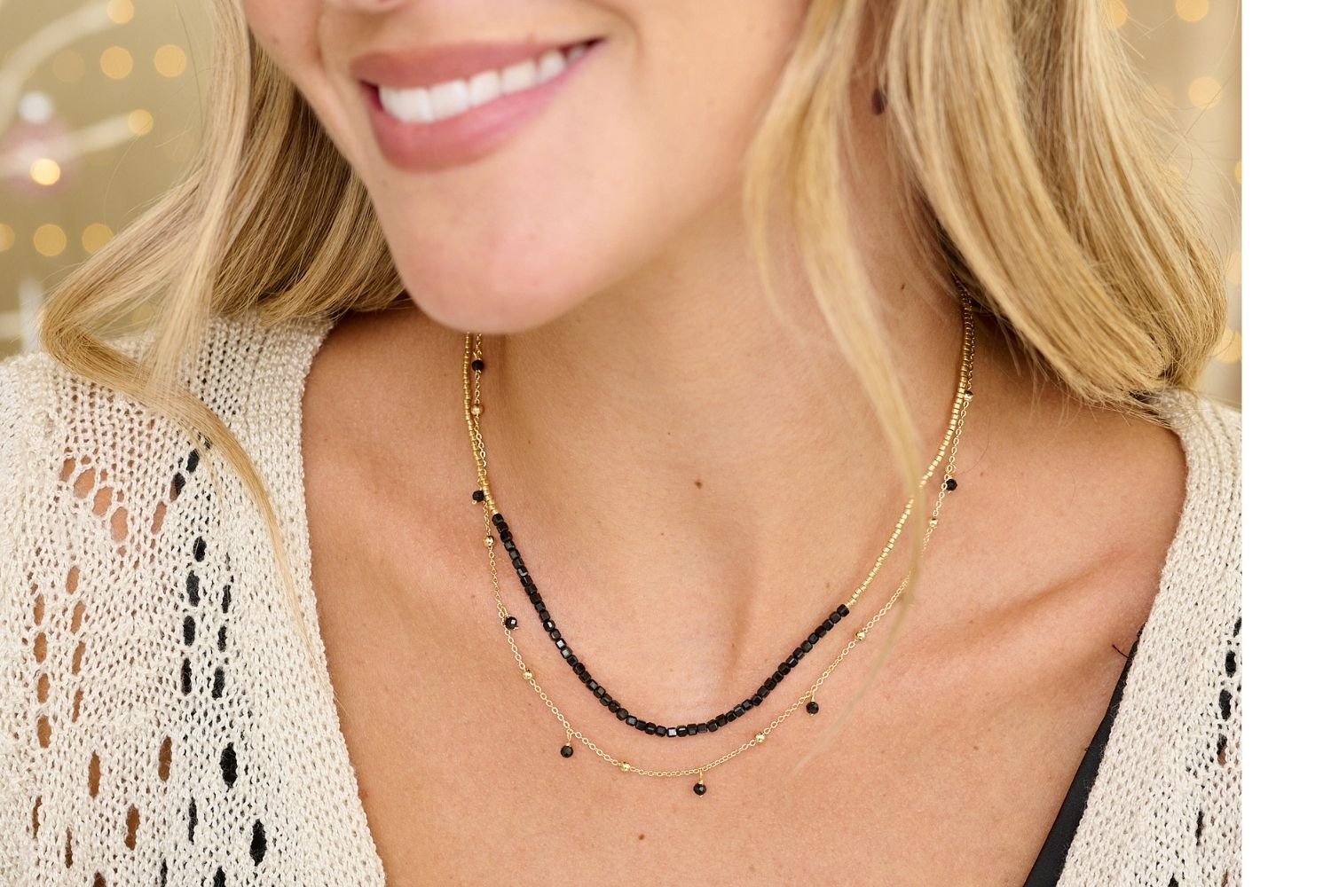 Lily Gold & Black Spinel Gemstone Beaded Necklace styled on the neck, showcasing faceted black spinel beads and delicate gold chains, ideal for elegant evening looks.