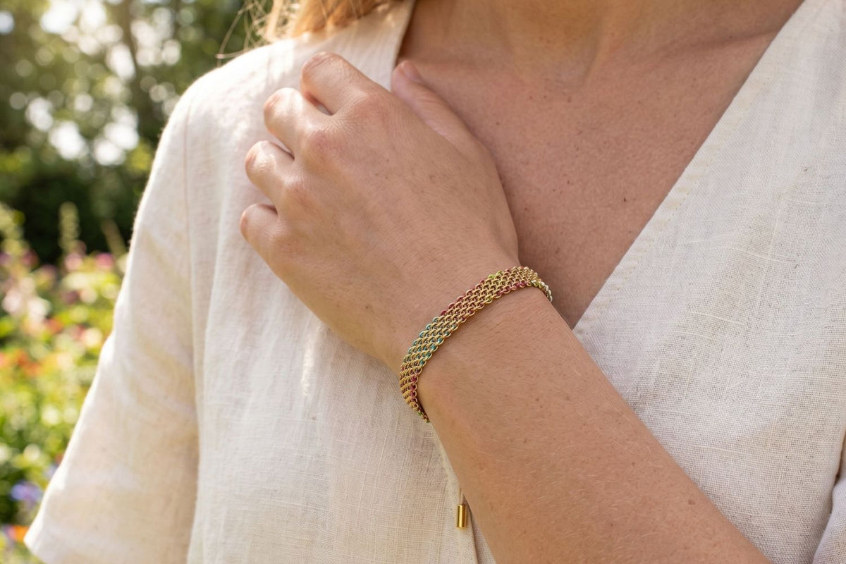 Millie Candy Mesh Woven Bracelet styled for waterproof holiday jewellery with candy colours and golden shine.