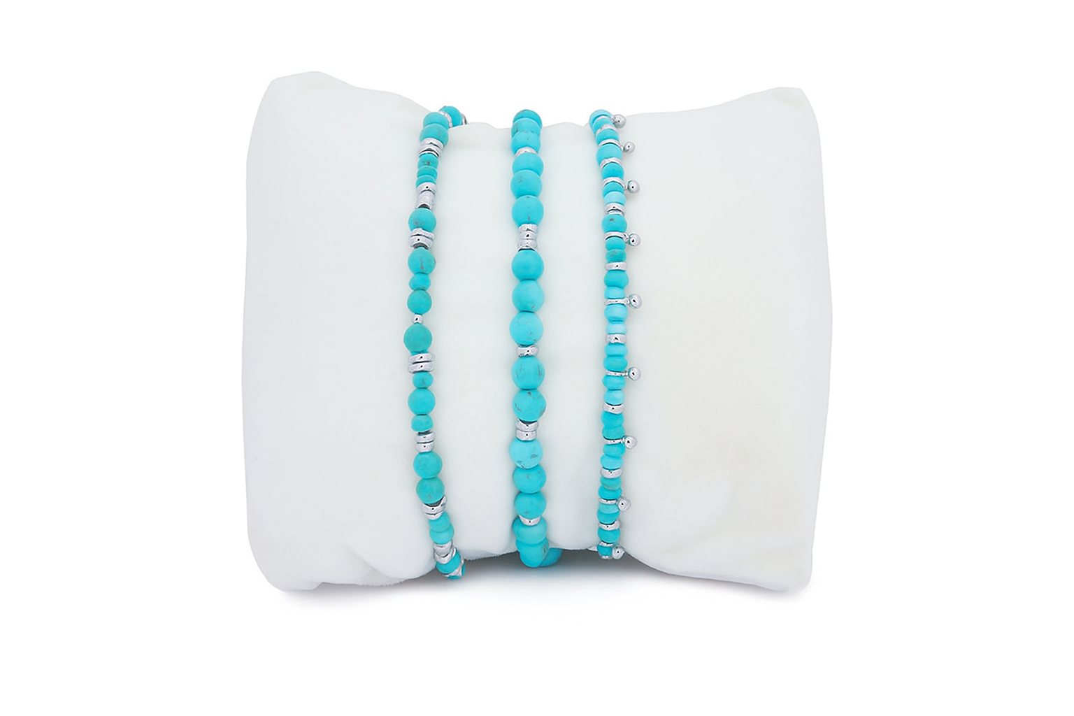 Moala Turquoise Silver Bracelet Stack featuring striking turquoise howlite gemstones and silver-plated accents in a trio of beaded bracelets.