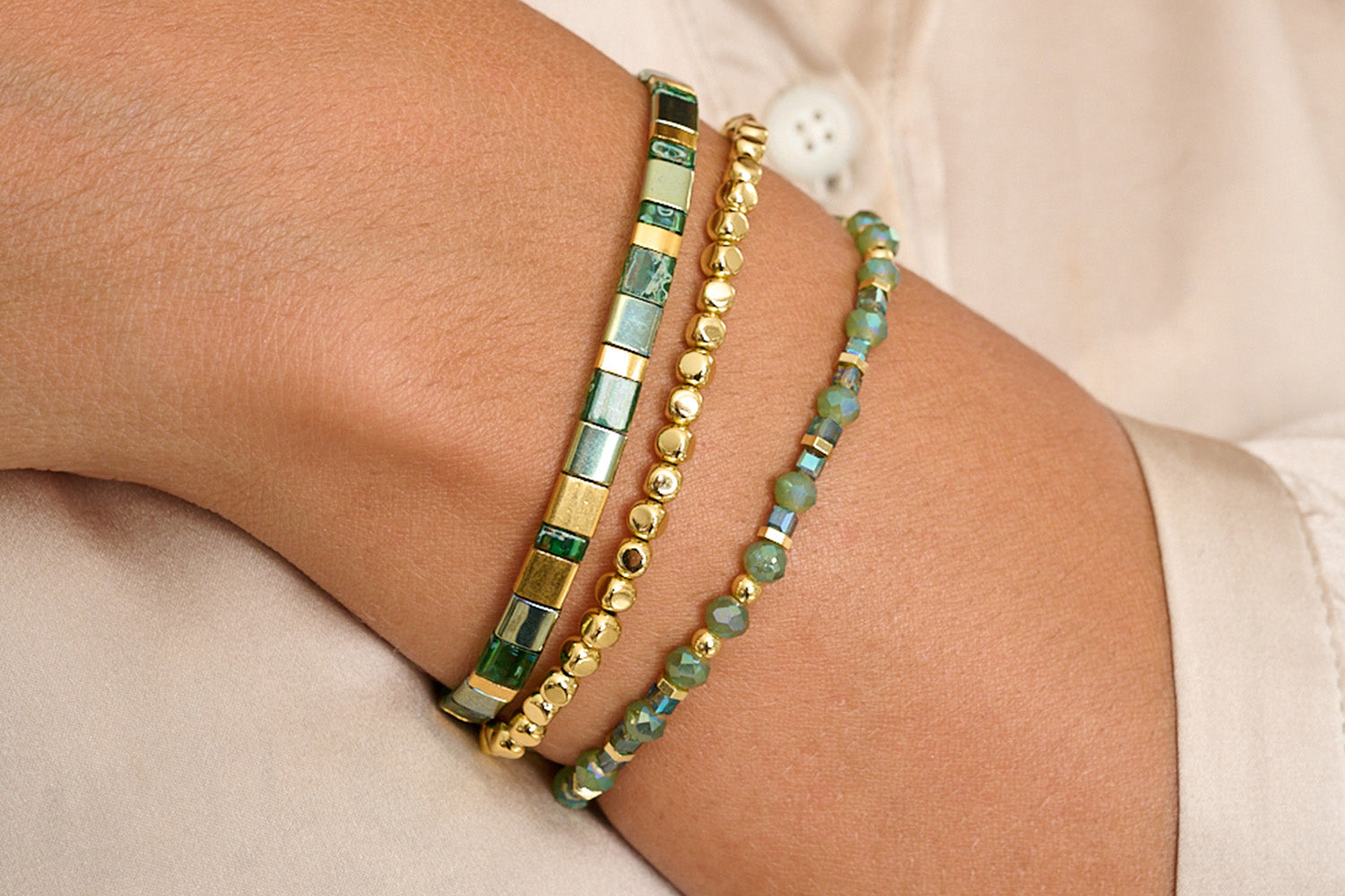The Mustique Stack styled on the wrist consisting of the Basil, Whistle and Dawn bracelets.
