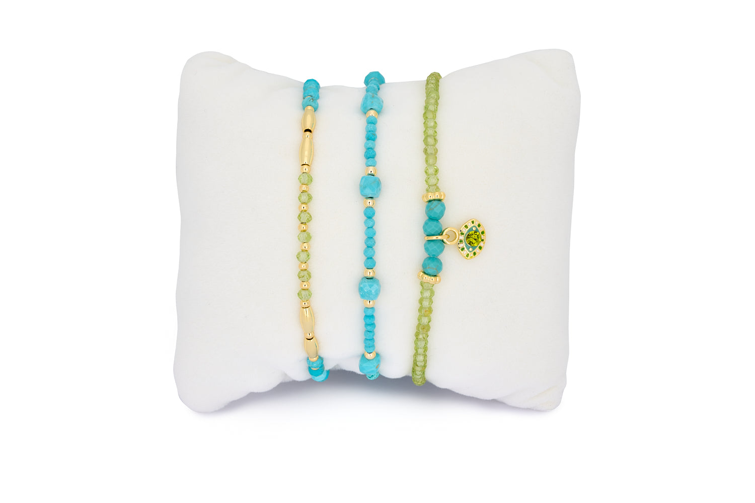 Nassau Peridot and Turquoise Gold Stacking Bracelet featuring vibrant turquoise and peridot gemstones with luxurious gold-plated accents in a layered bracelet set.