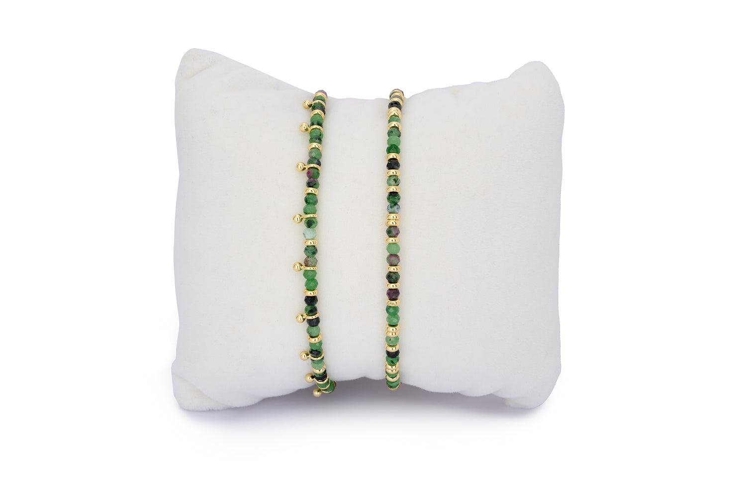 Serenity Ruby Zoisite & Gold Bracelet Stack featuring two gemstone bracelets with faceted ruby zoisite beads, one with aura bead accents and gold slider chains.