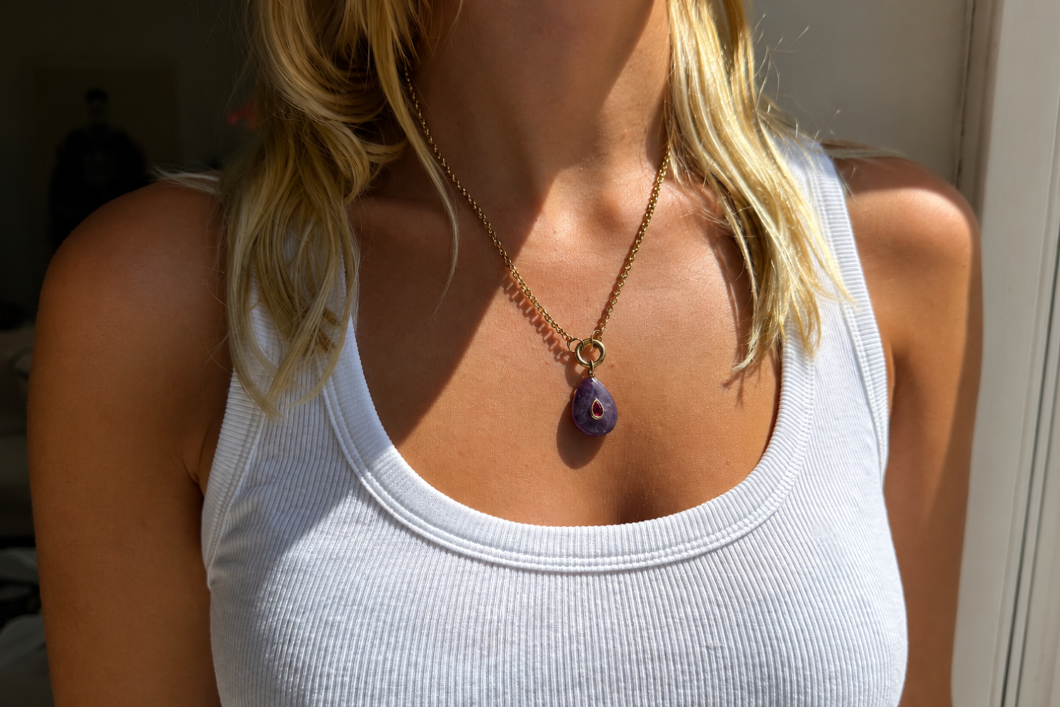 Thalia Long Amethyst Teardrop Pendant Necklace worn with a natural amethyst pendant on a long waterproof 14k gold PVD chain for elegant layered styling.