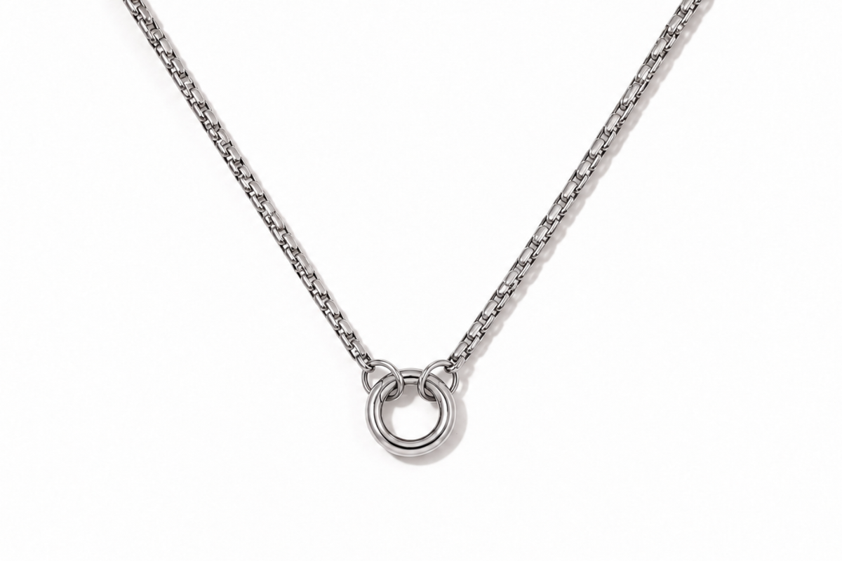 Thalia long silver chain necklace with front charm holder ring and polished stainless steel finish.
