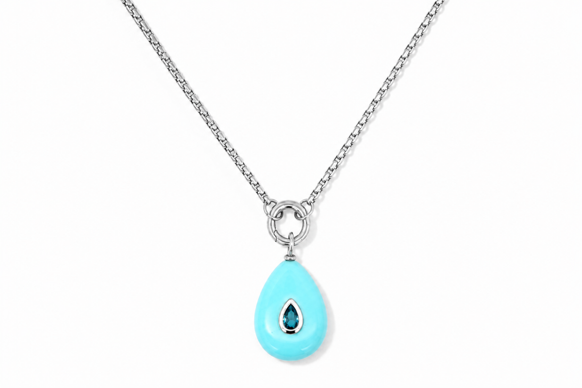 Thalia Long Turquoise Howlite Teardrop Pendant Necklace featuring a turquoise howlite gemstone with a blue crystal on a waterproof stainless steel chain.
