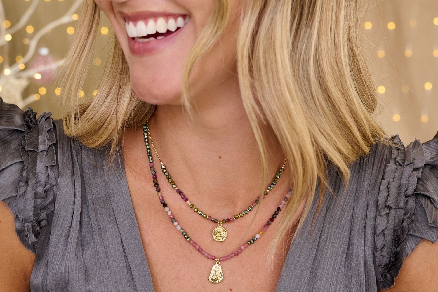 Umino Tourmaline Beaded Pendant Necklace styled on model, featuring vibrant tourmaline beads with gold-plated accents and an organic charm, perfect for layering.