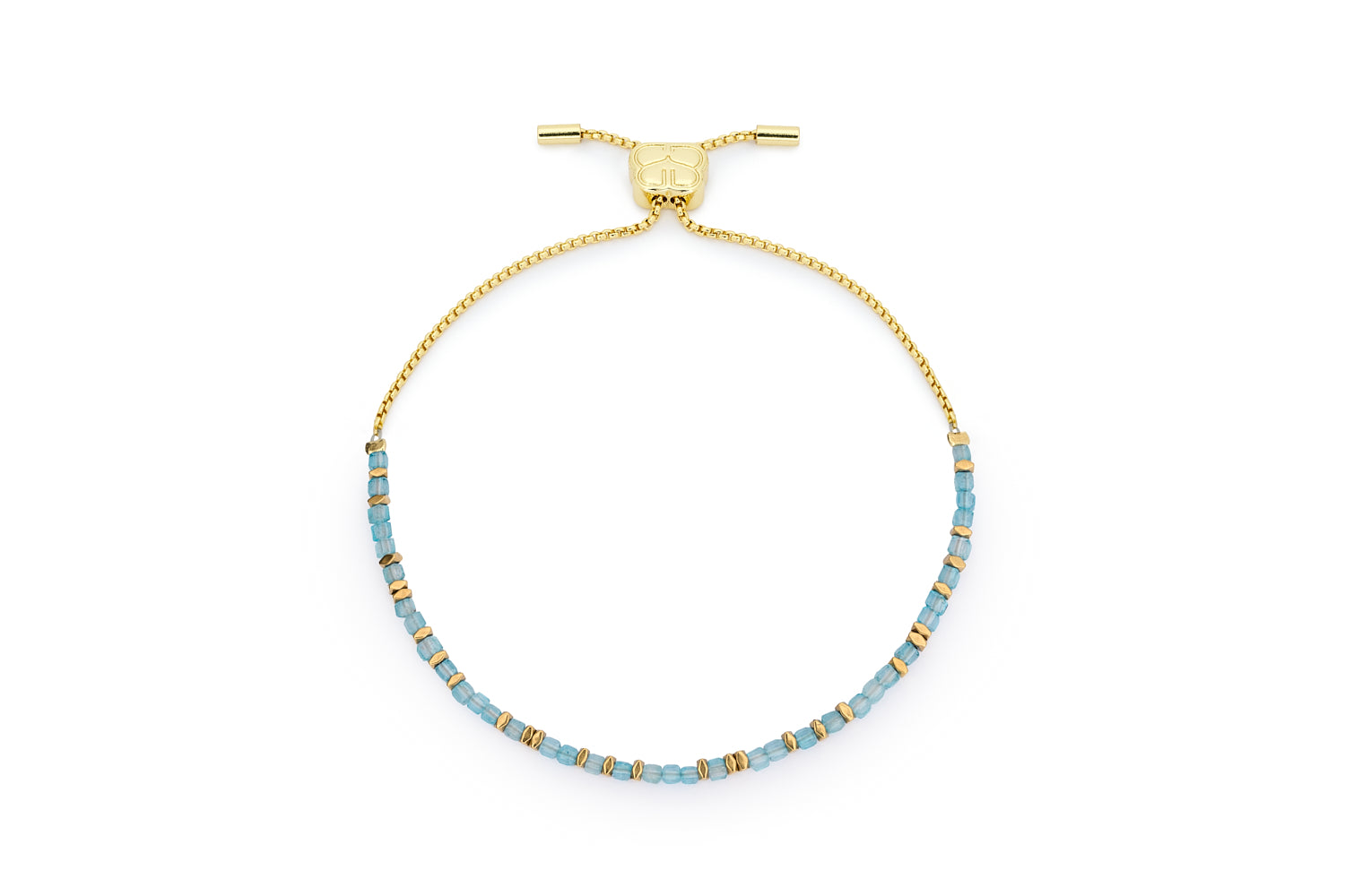 Valentina gold November birthstone bracelet with blue topaz faceted cube beads and Boho Betty charm on white background