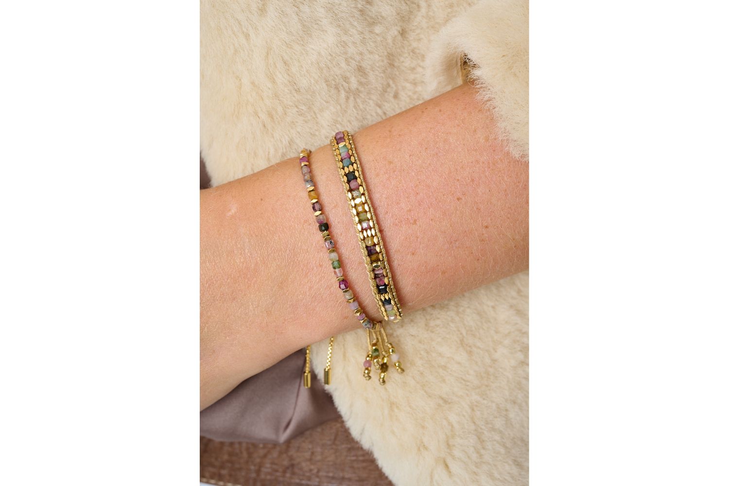 Valentina Gold & Tourmaline Gemstone Bracelet styled on the wrist, showcasing vibrant tourmaline beads with warm gold-plated accents—perfect for layering or wearing solo.