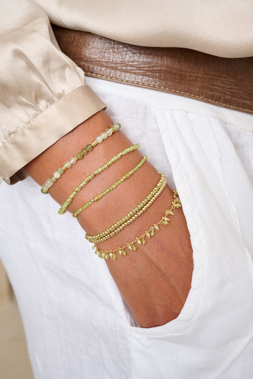Wonder green apatite and gold beaded bracelet featured on wrist with Boho Betty stacking bracelets