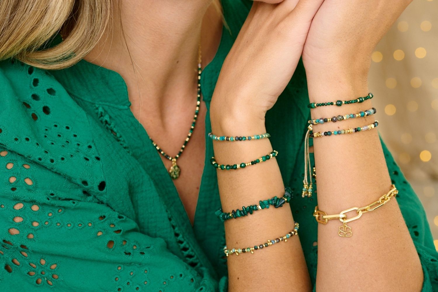 Wonder Gold & Malachite Stretch Bead Bracelet styled on the wrist, showcasing lush green malachite beads and shimmering gold accents, perfect for adding nature-inspired beauty to your look.