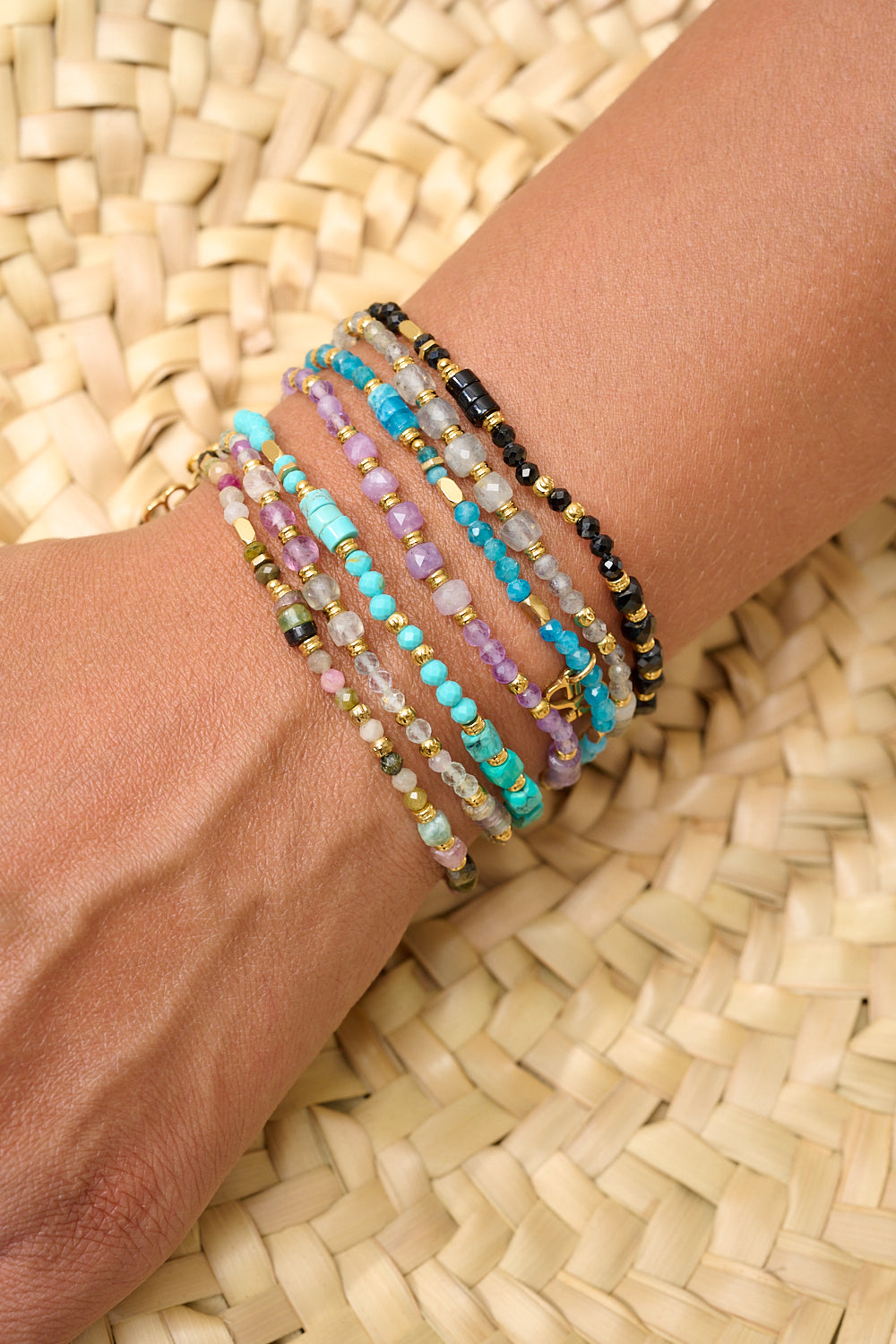 Black spinel bracelet stacked with other Boho Betty bracelets for a bold everyday look.