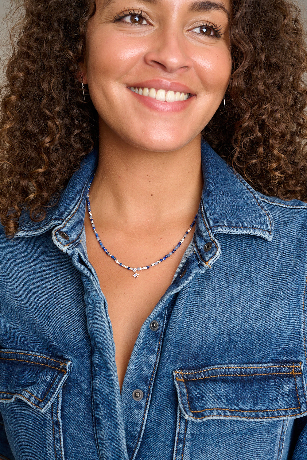 Yolanda silver kyanite gemstone necklace featured on neckline with Boho Betty necklace layers