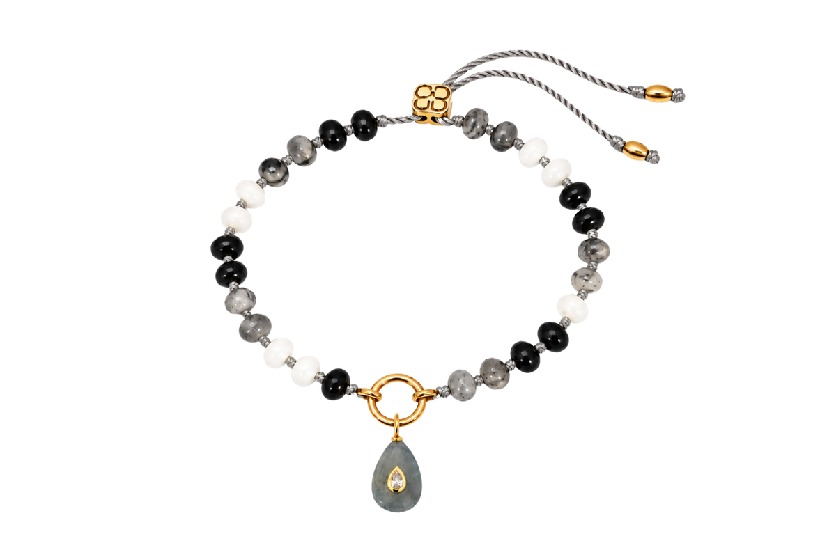 Zaha Black Mix gold charm carrier bracelet finished with a Fleurette labradorite teardrop charm, a waterproof Boho Betty gemstone bracelet.