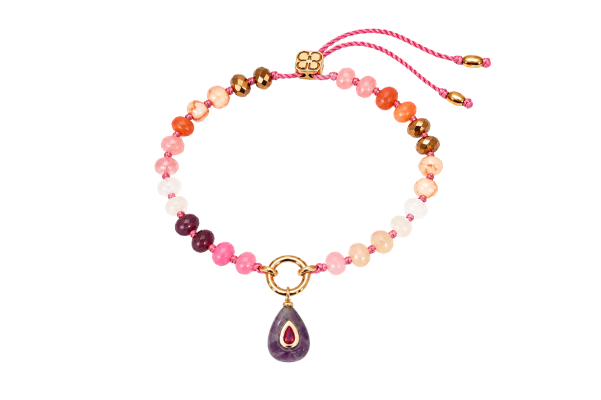 Zaha Red Mix gold charm carrier bracelet finished with a Fleurette amethyst teardrop charm, a waterproof Boho Betty gemstone bracelet.